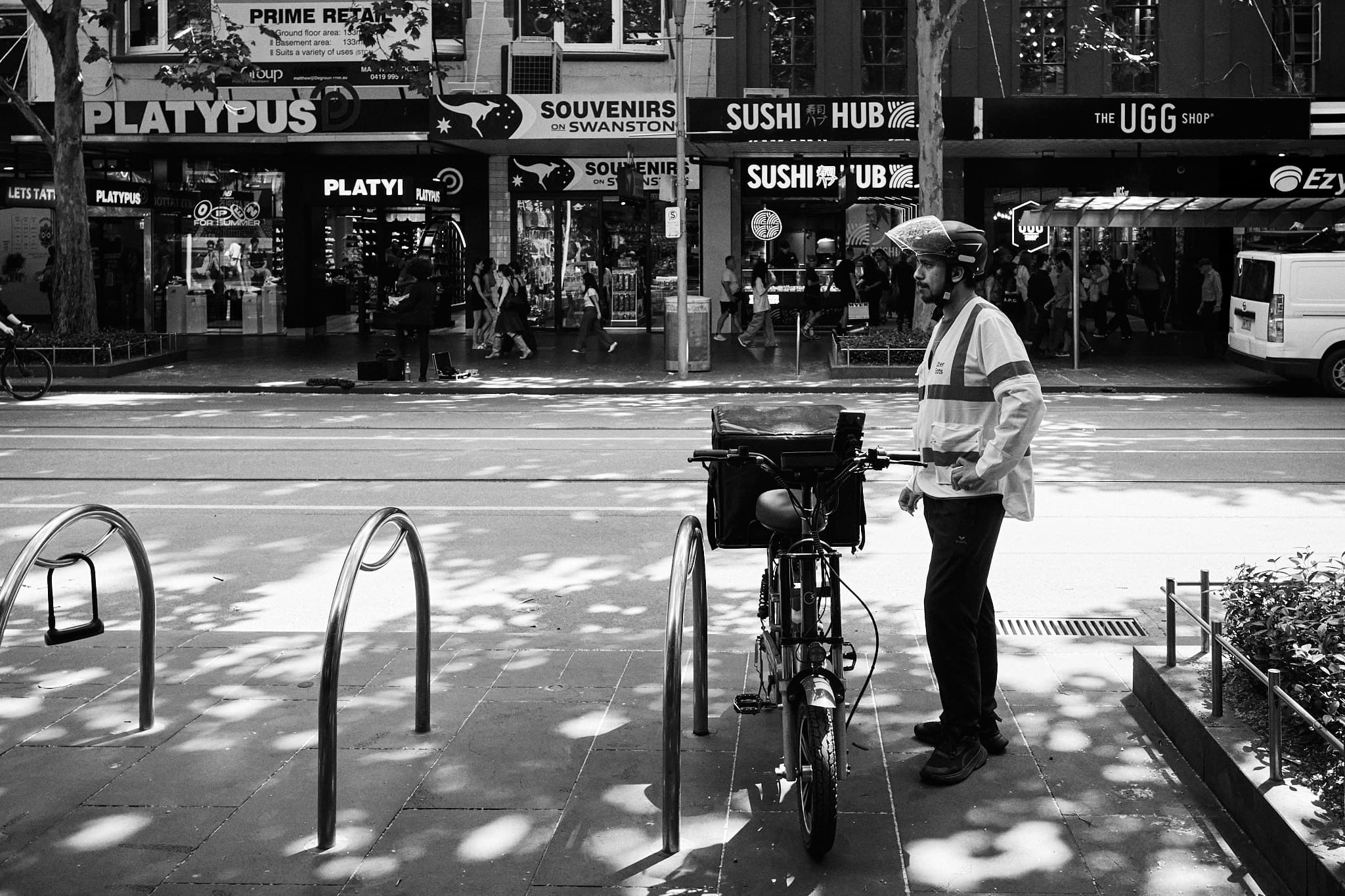 Parking officer in dappled light, Swanston Street